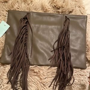 Boutique purchased fringe mink color clutch.